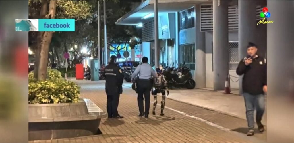 robô é escoltado pela polícia em via pública de Macau.